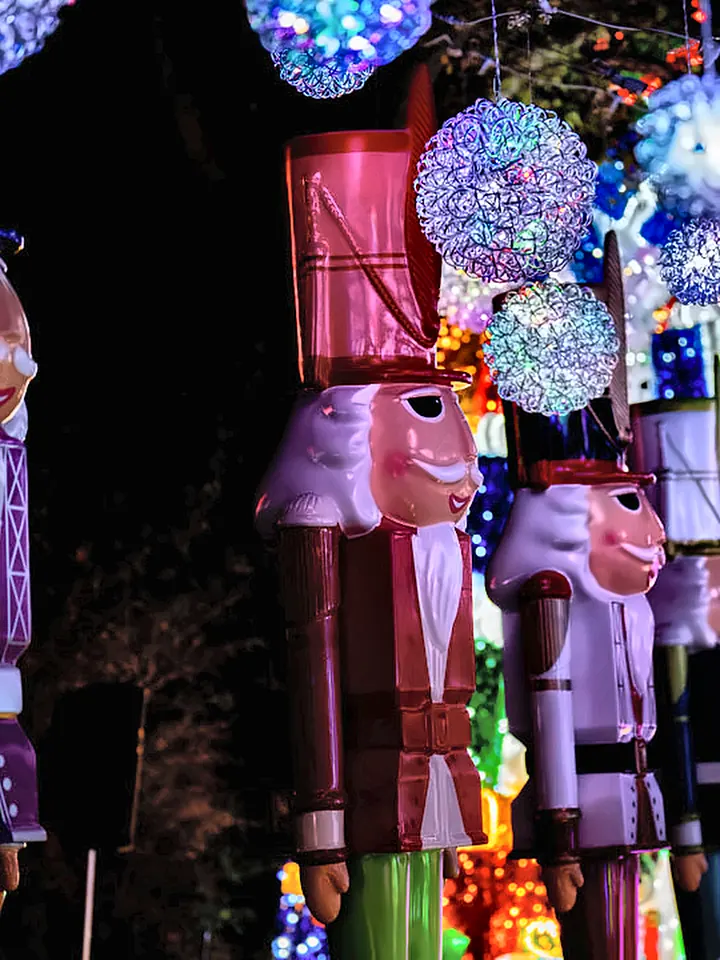 Giant nutcrackers under glowing ornaments