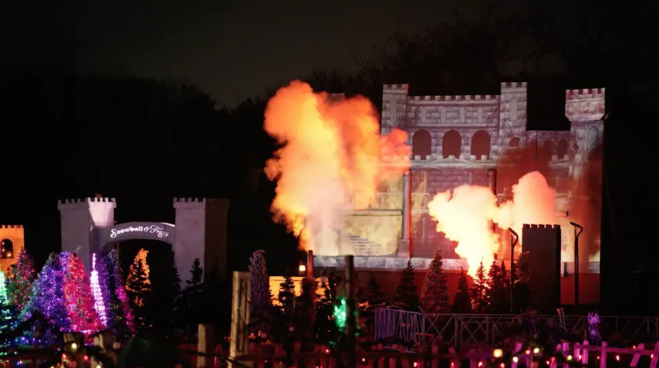 Fire bursts beside the castle next to the Snowball & Flurry archway