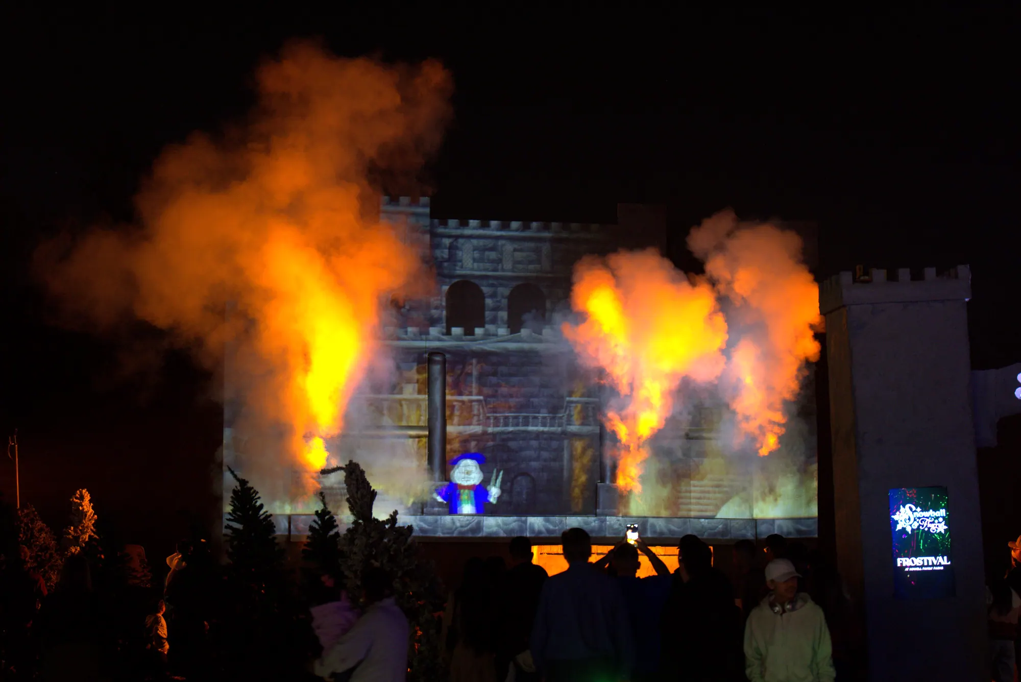 Flames bursting in front of the castle during the Snowball & Flurry show at Frostival